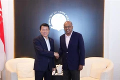 El ministro de Seguridad Pública de Vietnam, general Luong Tam Quang (izquierda) y el ministro del Interior de Singapur, K. Shanmugam (Fuente: VNA)