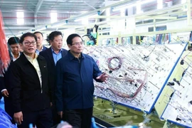 El primer ministro de Vietnam, Pham Minh Chinh, visitó una empresa en la provincia de Quang Nam en febrero. (Fuente: VNA)